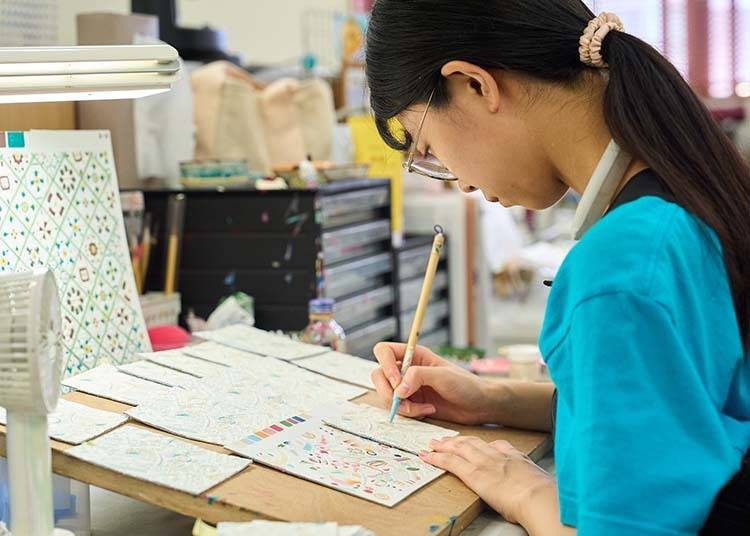 The workshop is a hub of quiet focus, buzzing with creative energy.