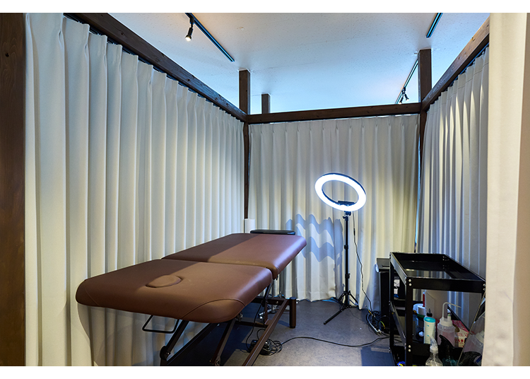 Each bed is set up with curtains for privacy.