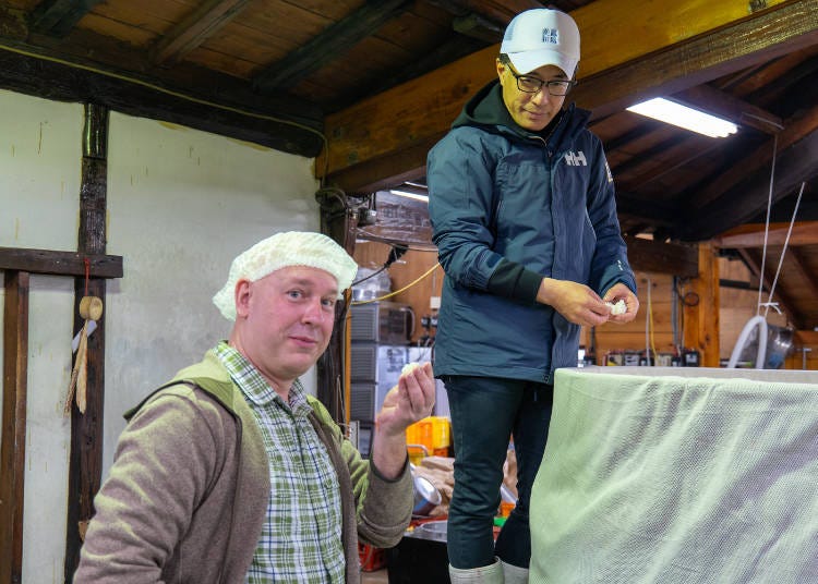 Trying freshly steamed sake rice