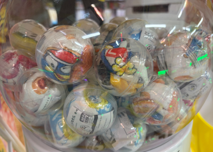 Japanese anime character capsule toys offered as travel memories