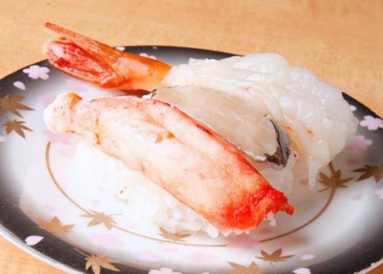 From the front tarabagani (king crab), awabi (abalone), and botan ebi (button shrimp), the price for one kan (serving) of each being 760 yen