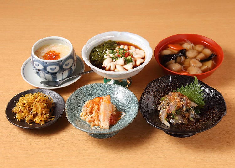Many dishes pair well with drinks. Try the odorless aji (lower right), or the Tachipon (upper middle), a combination of cod milt and sticky gagome kelp.