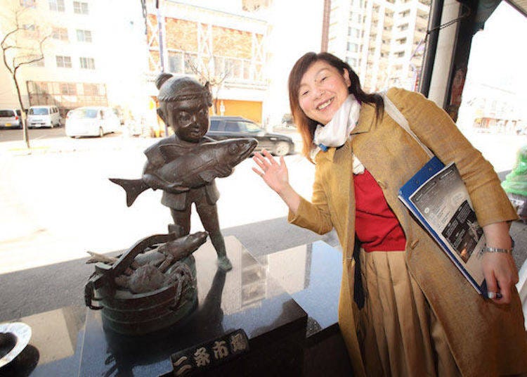 Occasionally we would see what appears to be a statue of a boy outside fish shops in Nijo Market