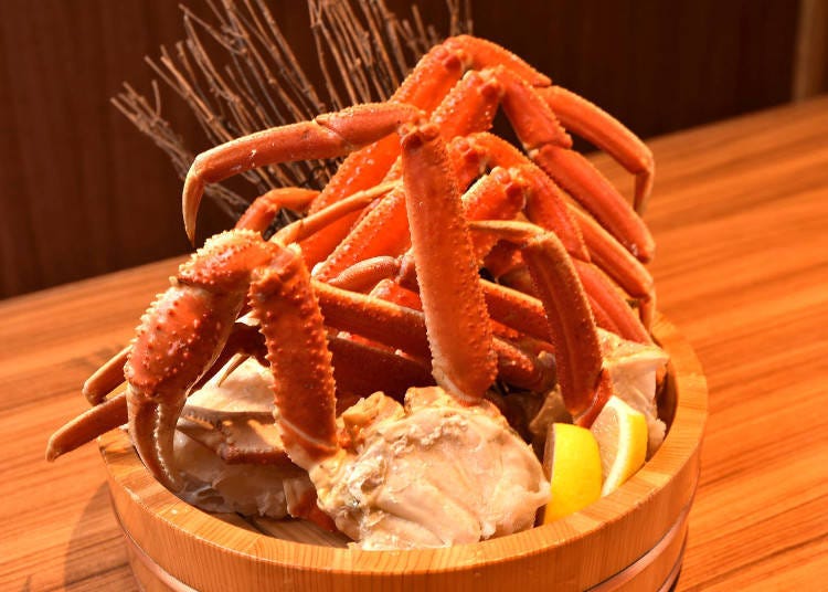 All-you-can-eat snow crab comes in a wooden bucket