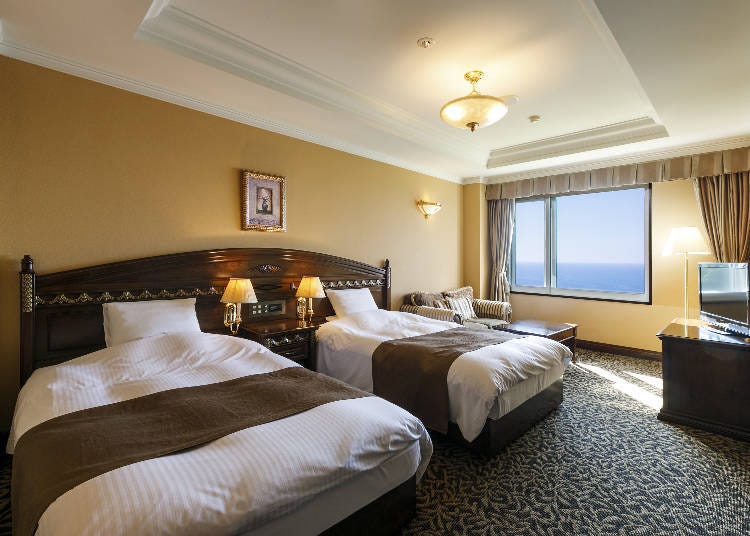 The popular Oceanfront Twin Room. Feel the ocean on the sofa.