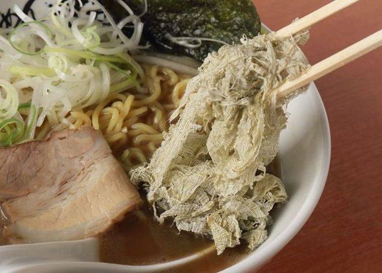 Heaping Tororo Kelp onto the ramen. With each addition, the soup becomes thicker