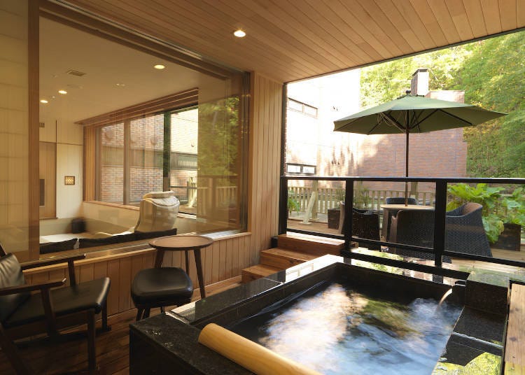The Onsen Rotenburo & Sauna Suite contains an open-air bath with a view
