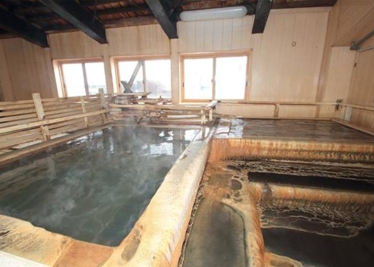 The wooden bath tubs. Each bat can fit about two to three people and feels like a private bathtub. The temperature for the baths are about 38 to 40°C.
