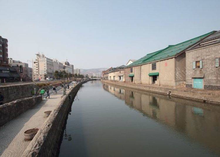 Otaru Canal viewed from Asakusa Bridge, a popular tourist attraction in Otaru, Hokkaido. Otaru Warehouse No. 1 is the fourth warehouse from the front