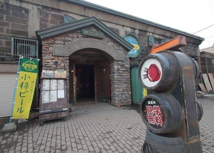 The entrance to the brewery is along the road on the other side of the canal