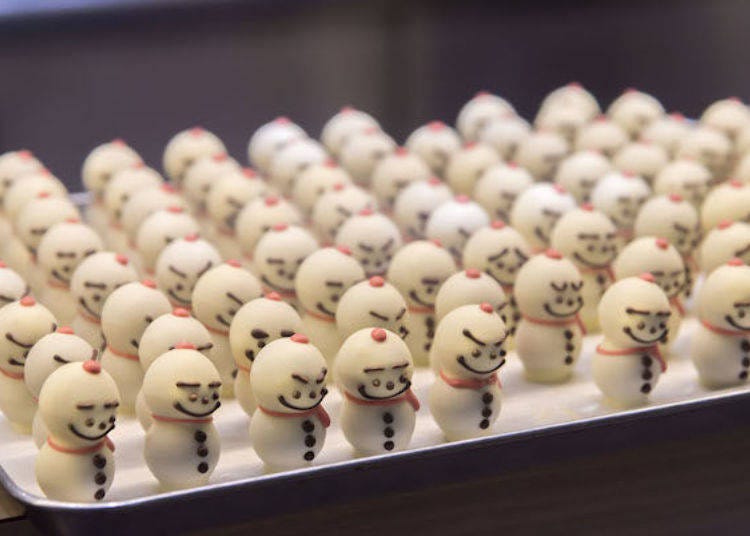 The cheerful expressions on these snowmen are made by hand!