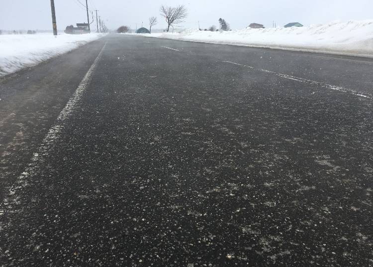 Black ice-burned road