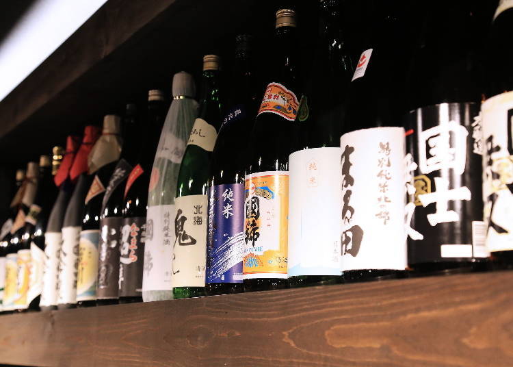 Rows of select Japanese sake, including Kunimare that is brewed in Hokkaido, line the shelves