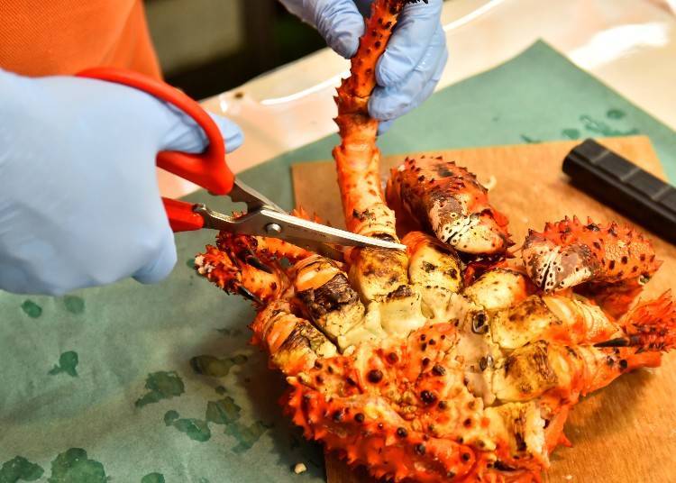 As with the king crab, scissors are put in the joint at the base of the leg and cut.