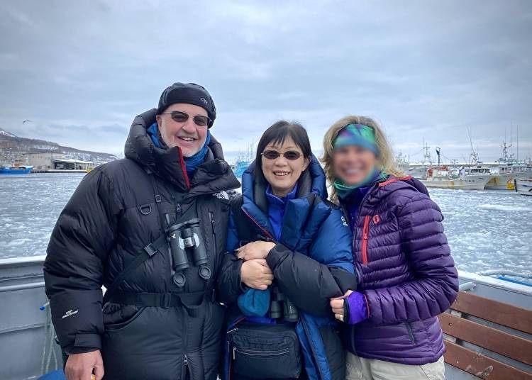 Mark, his wife Mayumi, and one of their guests enjoying the drift ice off the Shiretoko Peninsula (C) Mark Brazil