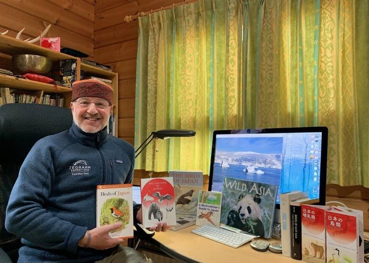 Mark in his office with his various books (C) Mark Brazil