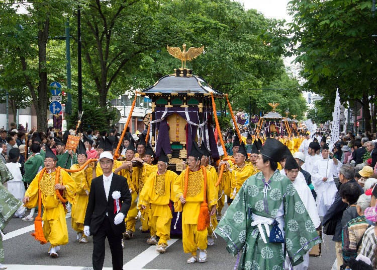 Mikoshi (portable shrines) and floats parade through the city center. Image credit: Hokkaido Shrine