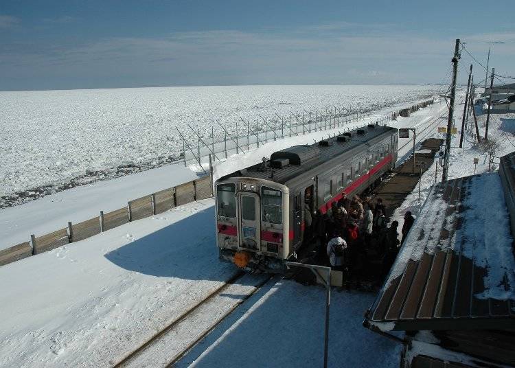 The train runs along the ice-covered Sea of Okhotsk