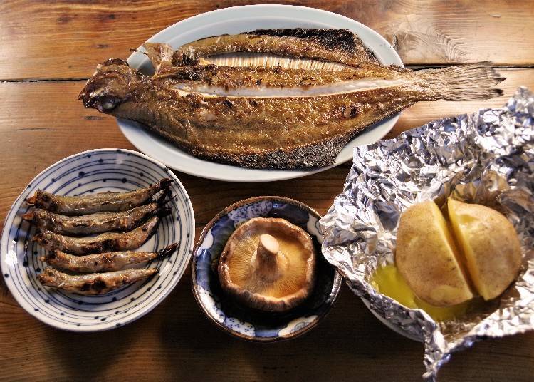 From the top, counterclockwise: Righteye flounder, Shishamo smelt, Shiitake mushrooms, and a roast potato with butter.