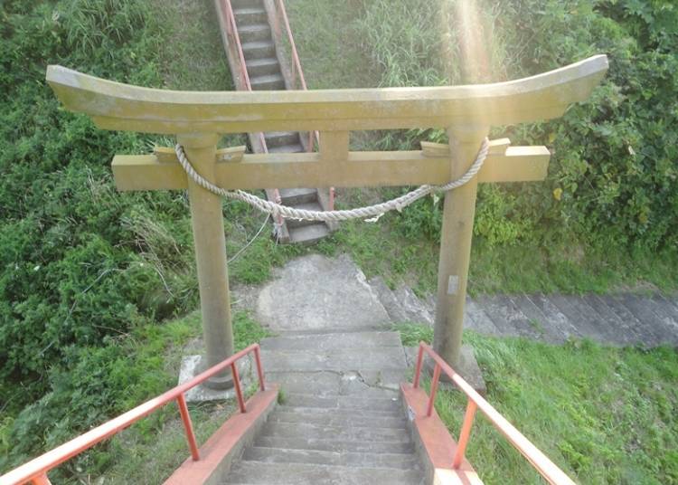The torii gate of Miyatsu Bentengu sits in a basin in the land. (Photo courtesy of Okushiri Tourism Association)