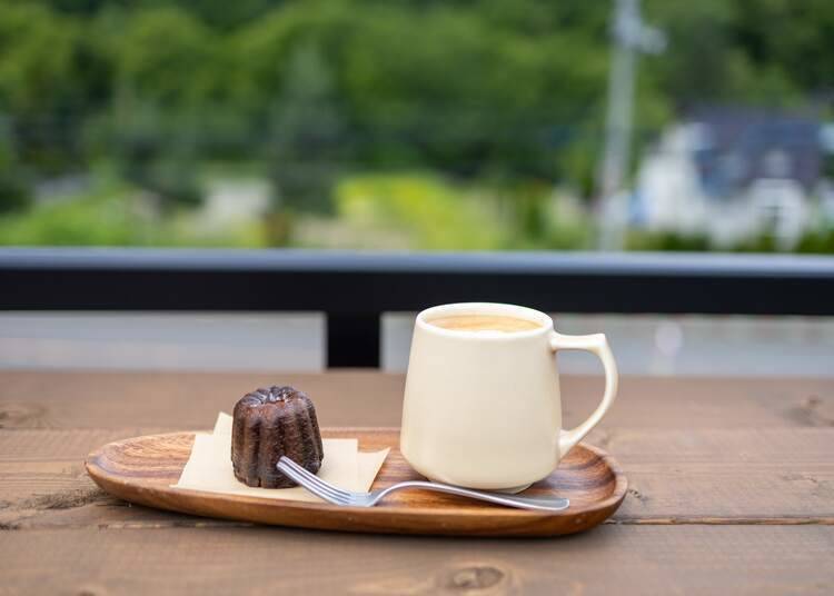 Cafe latte and plain canelé on the roof terrace