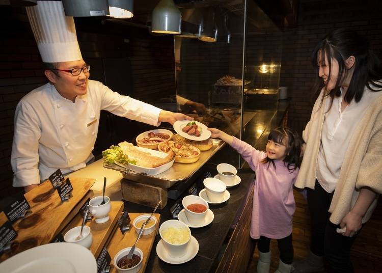 There's also a live kitchen where you can watch the chefs prepare meals right before your eyes! (Image: Hilton Niseko Village)