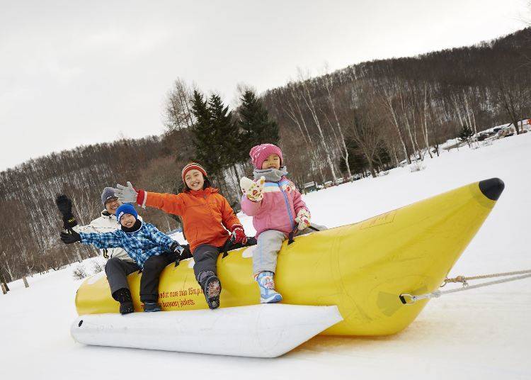 Ride the Banana Boat as a snowmobile tows you all around the fields of snow (Image: Greenpia Onuma)