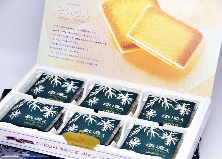 Shiroi Koibito, 18-piece box. Shiroi Koibito gets its name from a remark from the founder one day as he watched the snow start to fall: "Shiroi Koibito-tachi (White Lovers) are falling!"