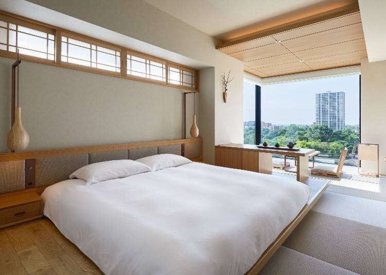 The Corner Double Room, designed for 1-2 guests, features a spacious layout with an expansive window.