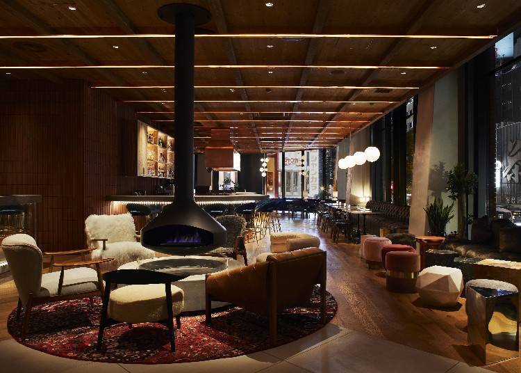 Hotel lobby features a fireplace and inviting atmosphere