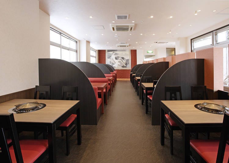 Inside the Takikawa Main Store: Each table is equipped with a special Jingisukan pots and a dedicated spot for the fire. (Photo courtesy of Matsuo Jingisukan)