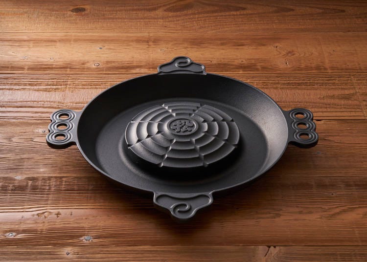 Matsuo Jingisukan's original Jingisukan skillet, featuring a raised center where the meat is placed. (Photo courtesy of Matsuo Jingisukan)