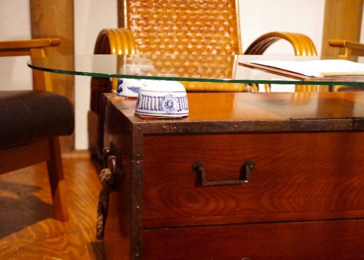 This table was crafted by the owner by repurposing over 100-year-old teacups and a chest that had been lying around the storehouse.