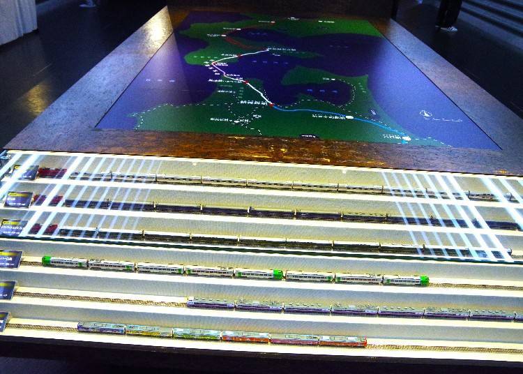 Scale models of the various train cars that have operated through the Seikan Tunnel are on display.