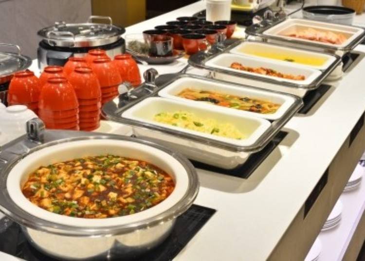 Sichuan-style spicy mapo tofu (front) and other dishes.