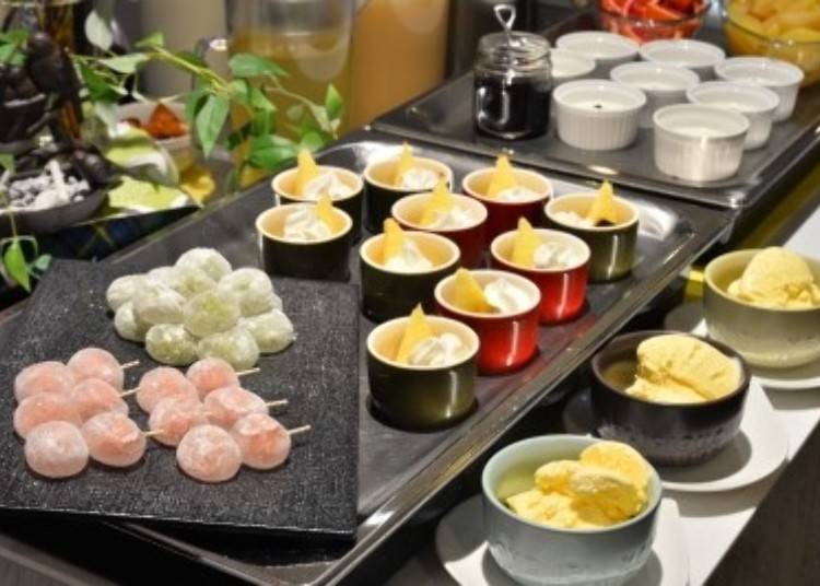 The dessert selection includes ice cream and traditional Japanese sweets like dango (front).