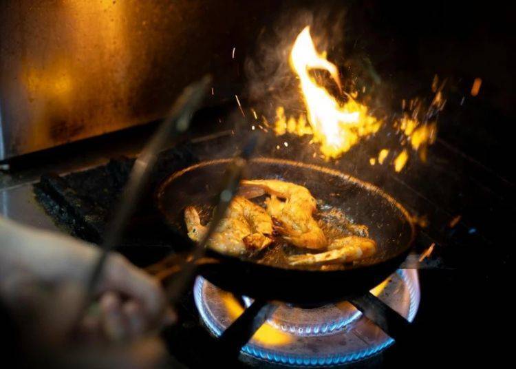 Prawns sizzling away. The aroma of garlic is irresistible.