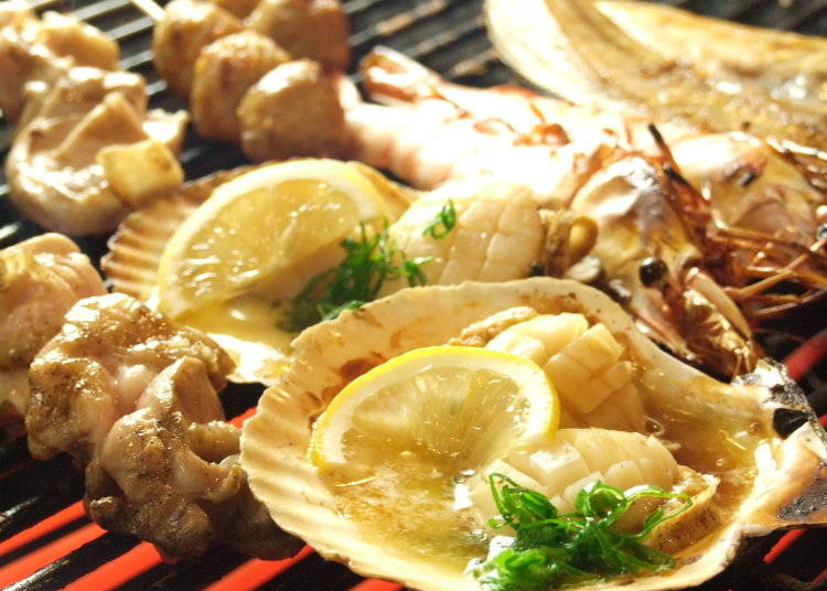 Scallop grilled in its shell. The flavor of the soy sauce and butter really stand out