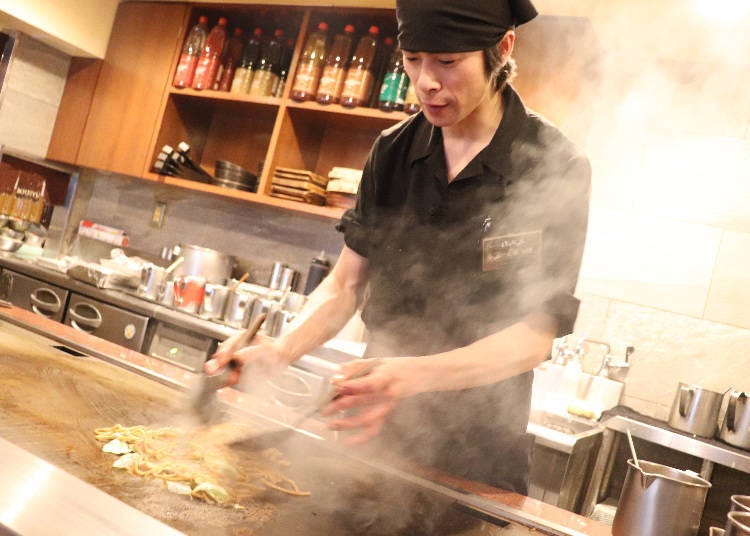 The steam rising from the open kitchen at the center of the establishment simulates the appetite
