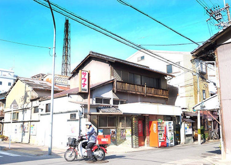 The large chimney is a landmark. The entrance to Ajiki Alley is on the right side of the public bath Daikoku-yu (rear right of photo)