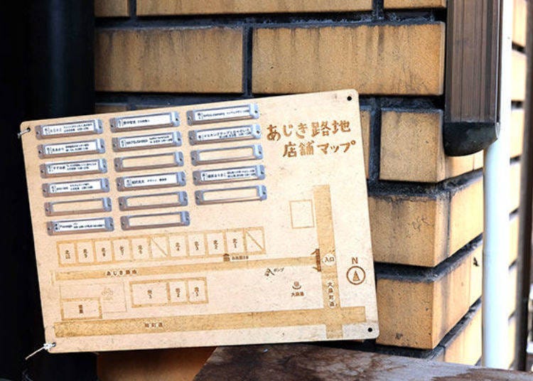 A resident map at the entrance of Ajiki Alley. The row houses are lined from north to south across the alley.