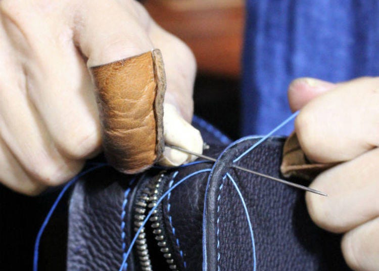 Mr. Matsushima carefully sews by hand, one stitch at a time