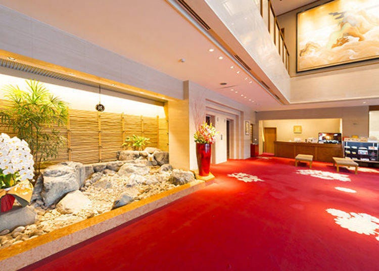 The softly carpeted lobby floor looks exactly like a hotel lobby