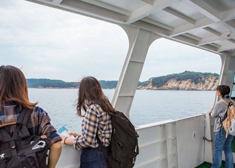 Enjoying the pleasant sea breeze while riding the ferry