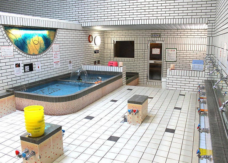 Large baths and a spacious wash area. A sauna is at the far end. (Women's bath pictured)