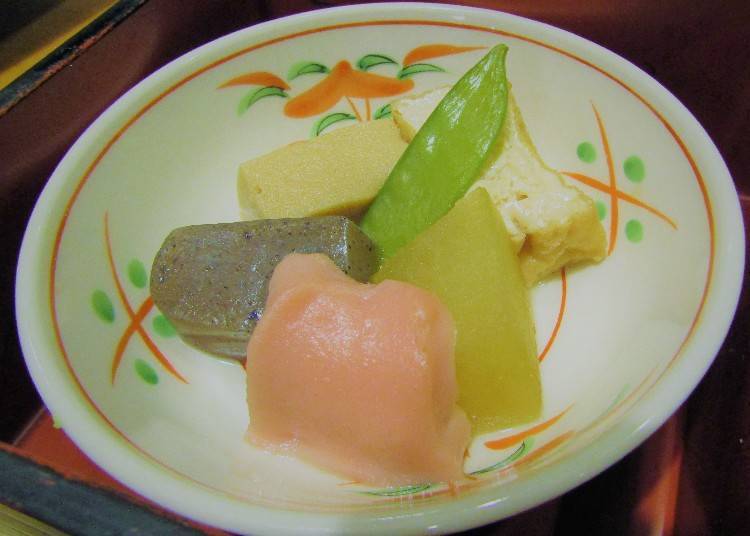 Five-colored cooked food platter with seasonal ingredients