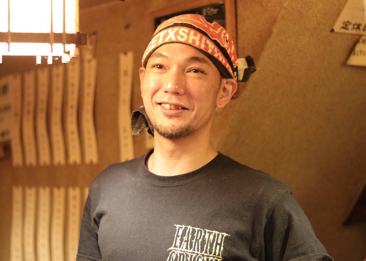 Uno, the shop owner, has a warm and charming smile