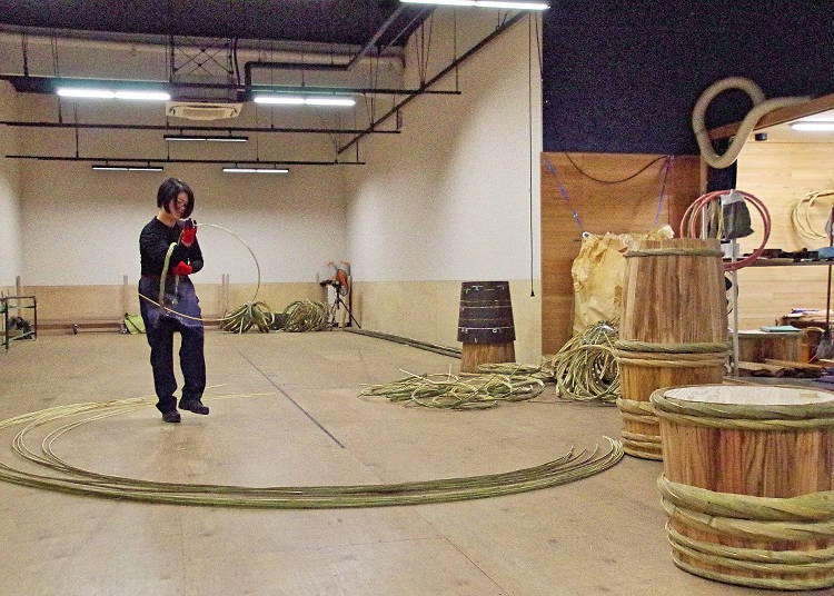 Tagamaki: Bending the bamboo to make the "taga," or "hoops," that hold the barrel together.