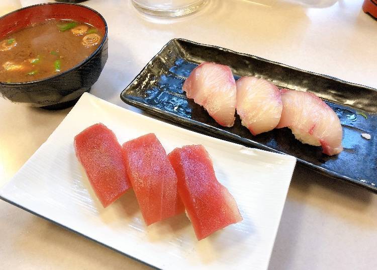 Clockwise from front: tuna, red miso soup (with fish), 150 yen each; hamachi (Japanese amberjack), 300 yen (all include tax)