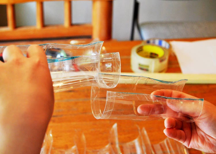 Put plastic bottles on top of each other, attach the tape, and connect them